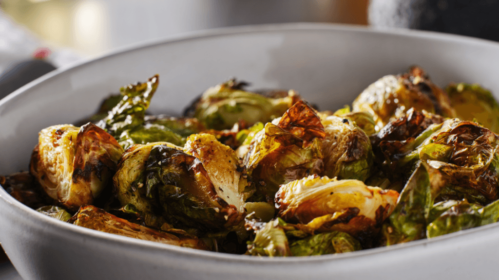 Roasted brussel sprouts with apples and pistachios, a nourishing whole-food recipe shared by a holistic chiropractor in Marietta GA focused on gut health and wellness.